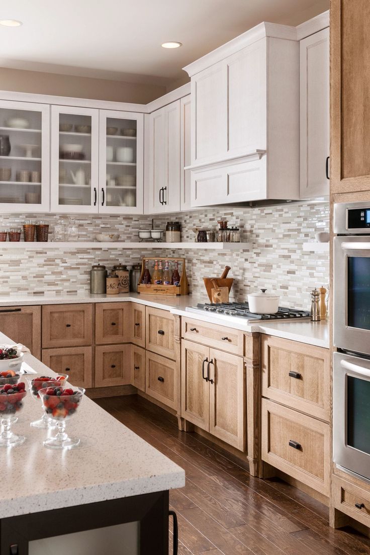 a kitchen filled with lots of wooden cabinets