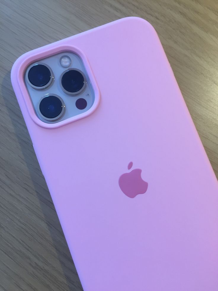 an iphone case sitting on top of a wooden table