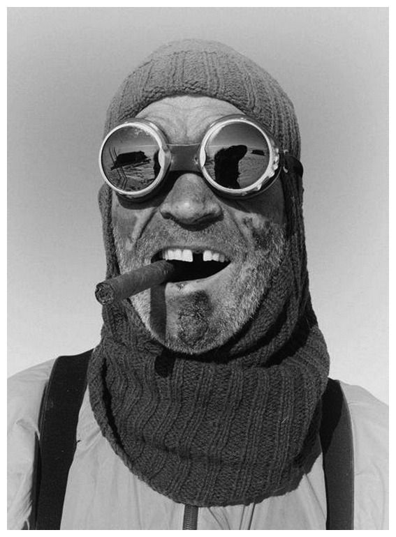 a man wearing goggles and a scarf