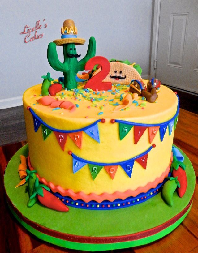 a birthday cake decorated with an image of a mexican character on top and decorations around the edges