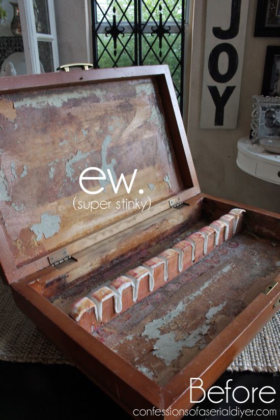 an old wooden box with the word ew super stinky written in white on it