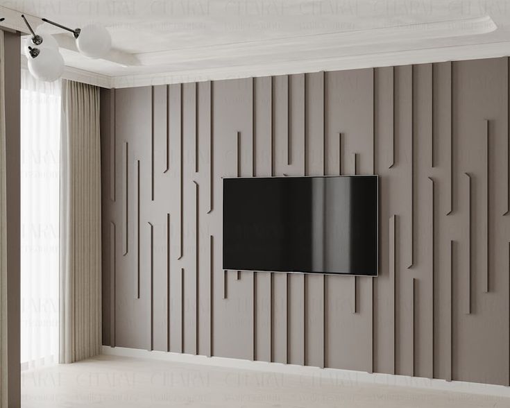 a flat screen tv mounted to the side of a wall in an empty living room