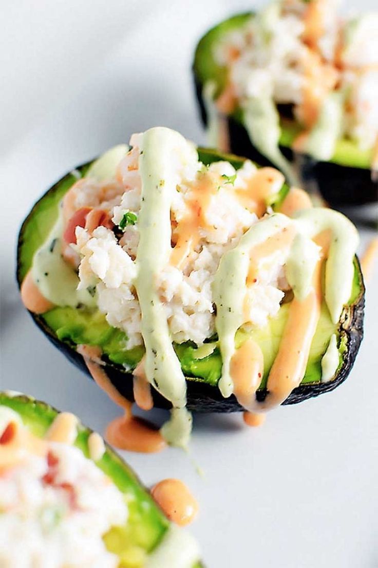 cucumbers stuffed with rice and sauce on a plate