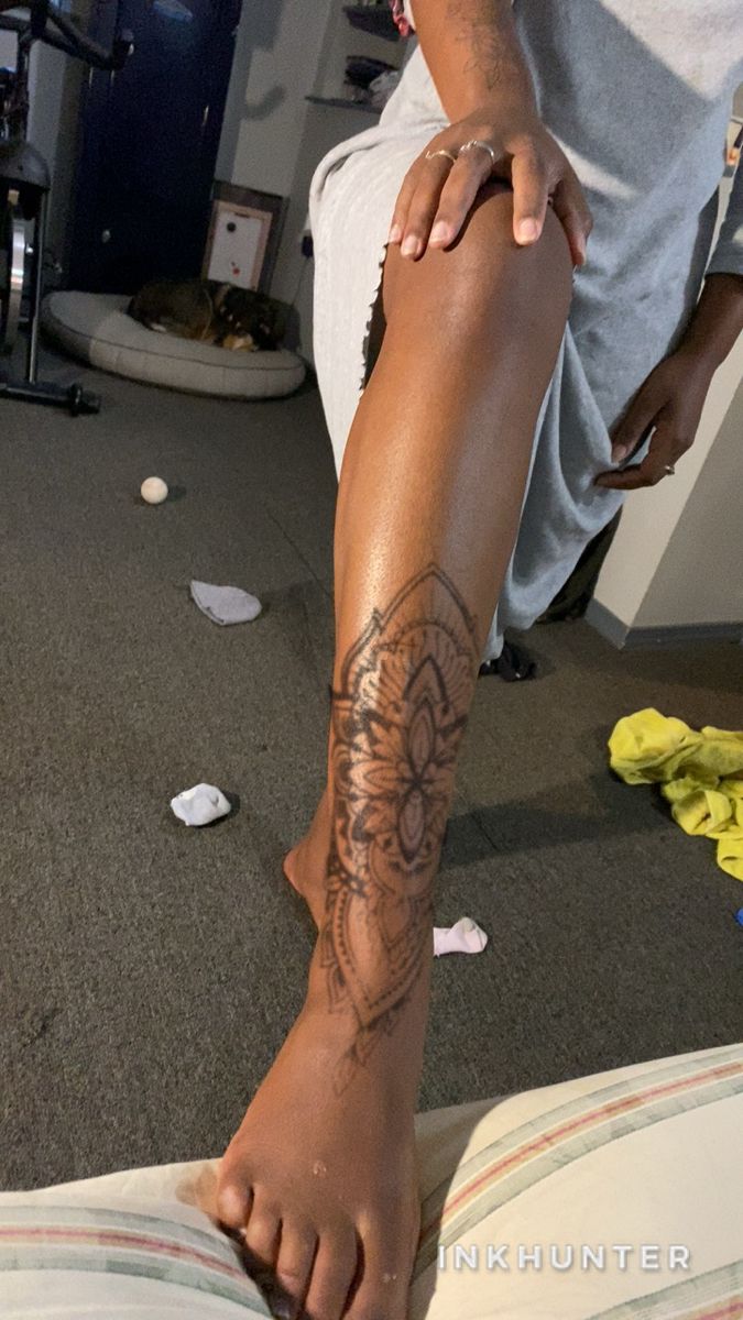 a person with a tattoo on their leg