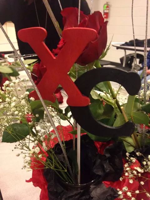 a bouquet of flowers with the letter x on it