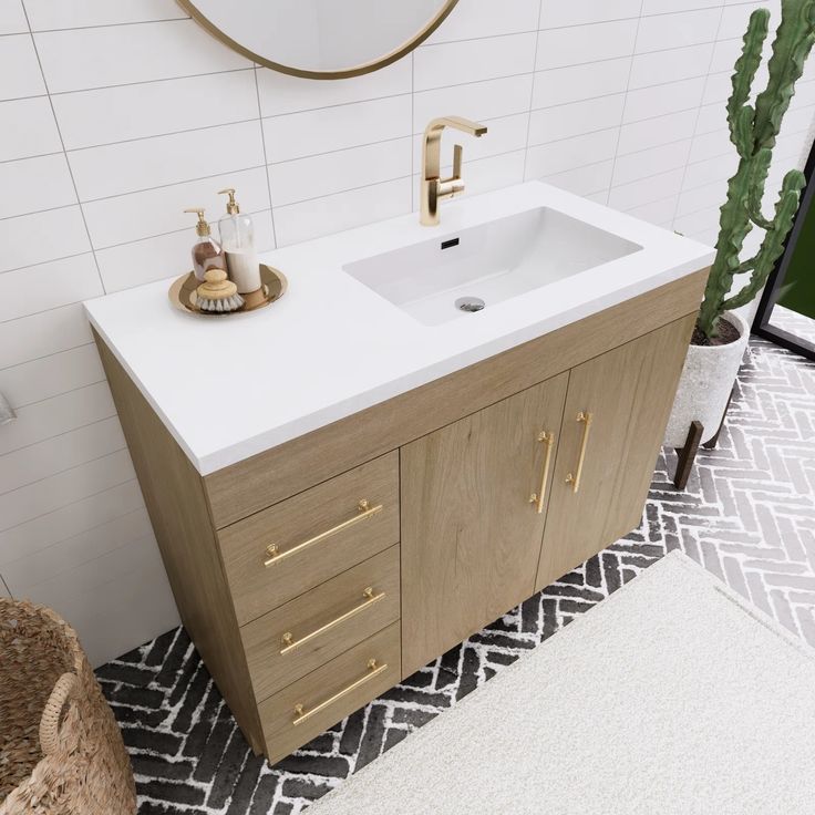 a bathroom with a sink, mirror and rug