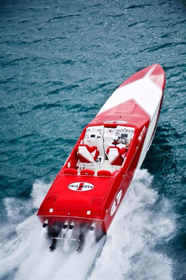 a red and white boat in the water