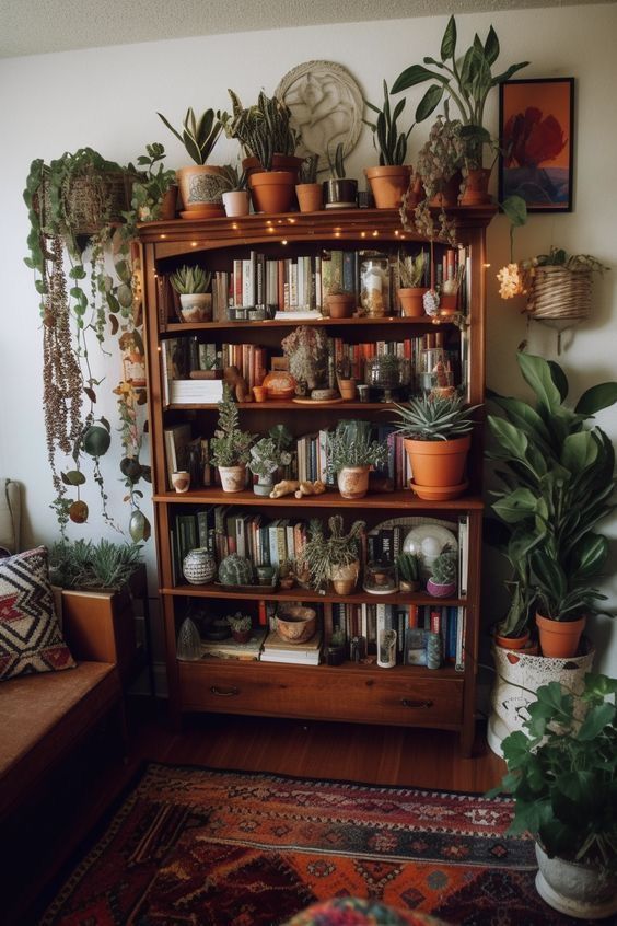 a living room filled with lots of plants and potted plants on top of wooden shelves