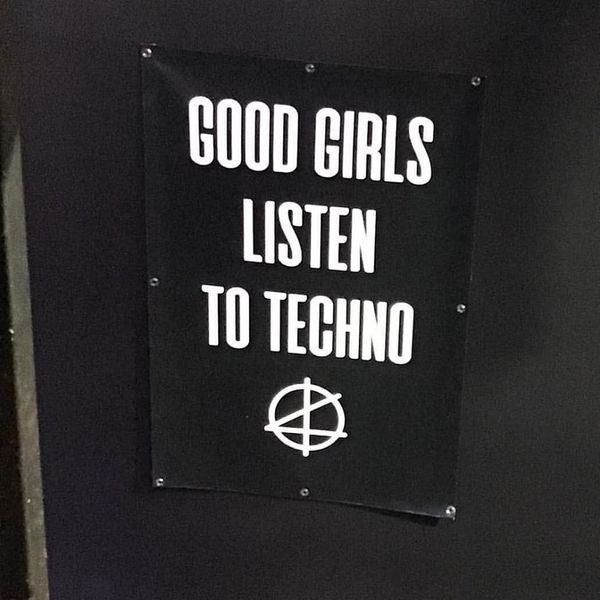 a sign that says good girls listen to techno on the side of a door