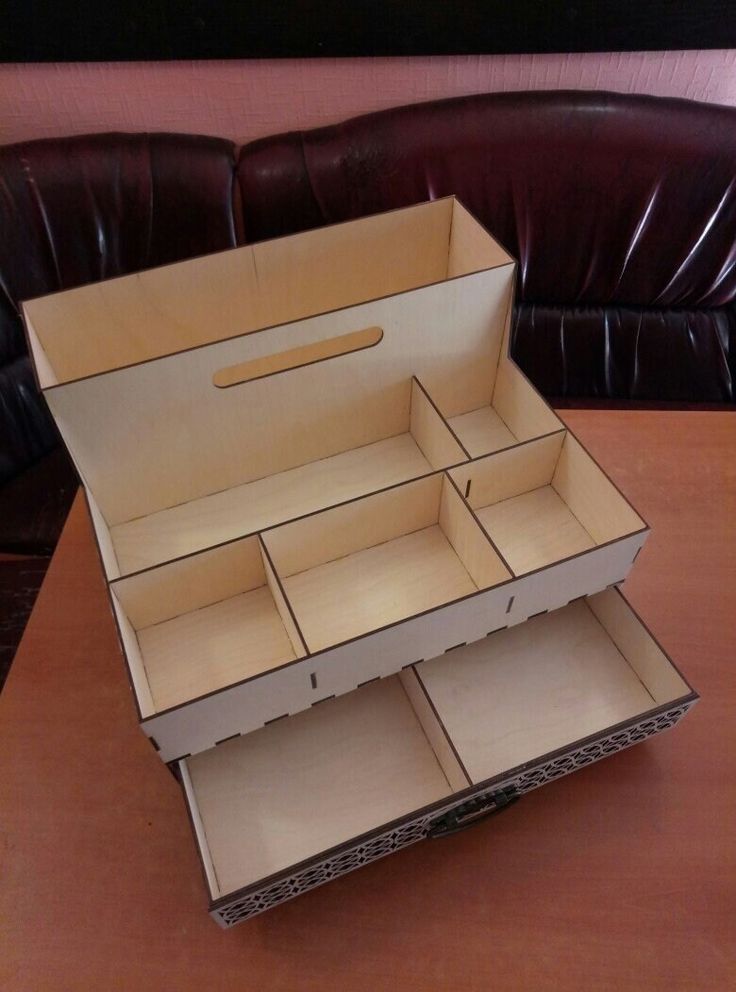 an open cardboard box sitting on top of a wooden table