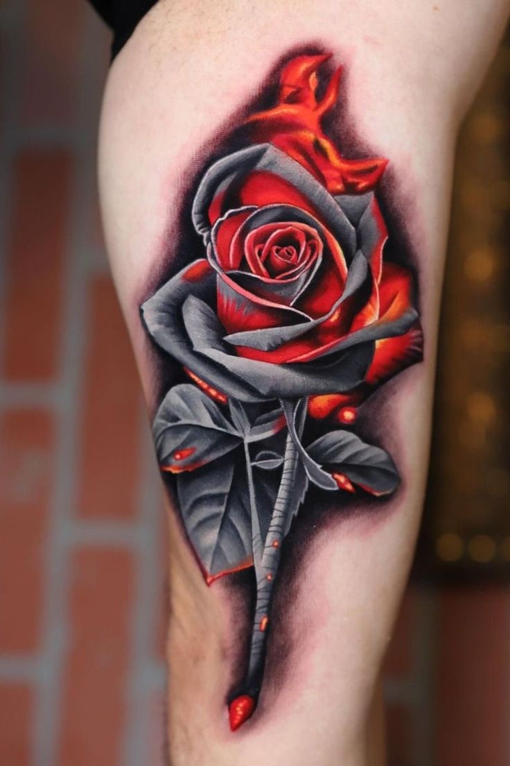 a rose tattoo on the leg with red and black ink, done by an artist