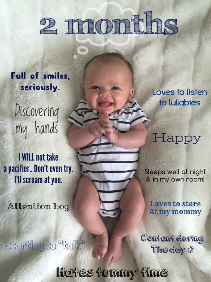 a baby laying on top of a blanket with the words 2 months written in front of it