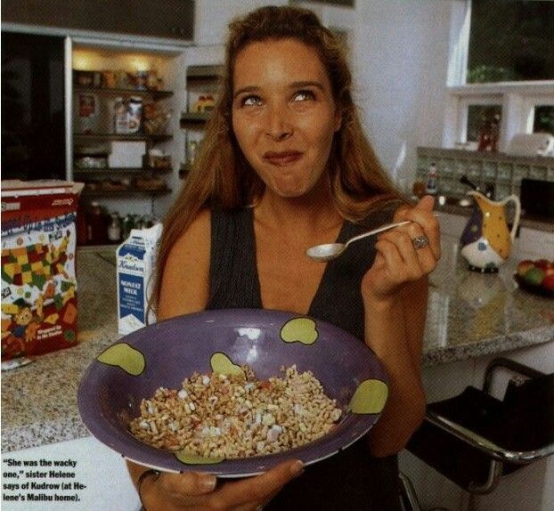 a woman holding a bowl of cereal in her hands