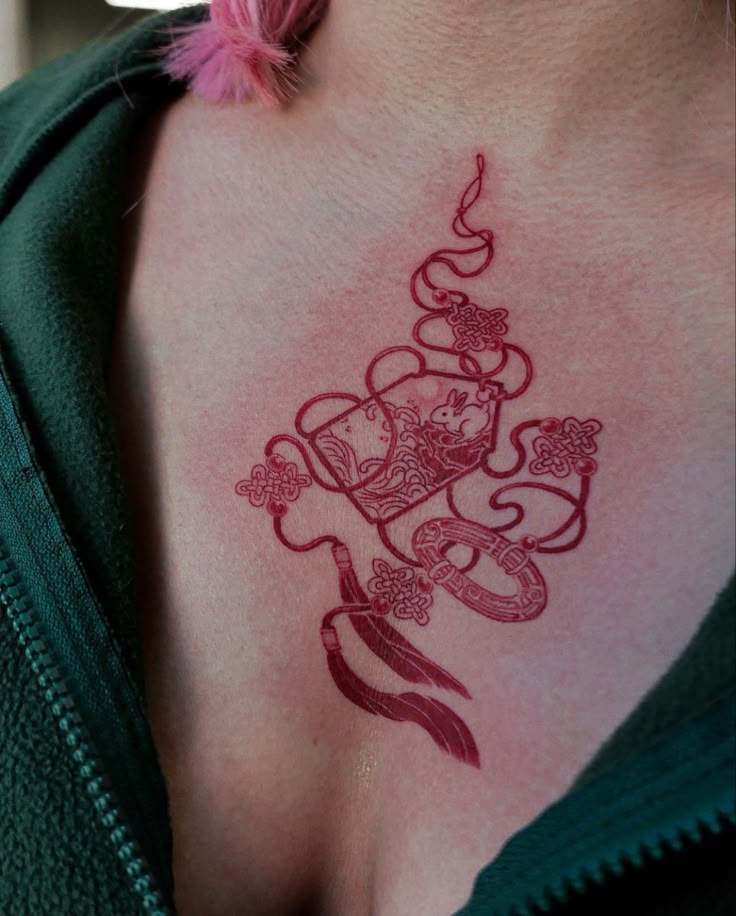 a woman with a tattoo on her chest