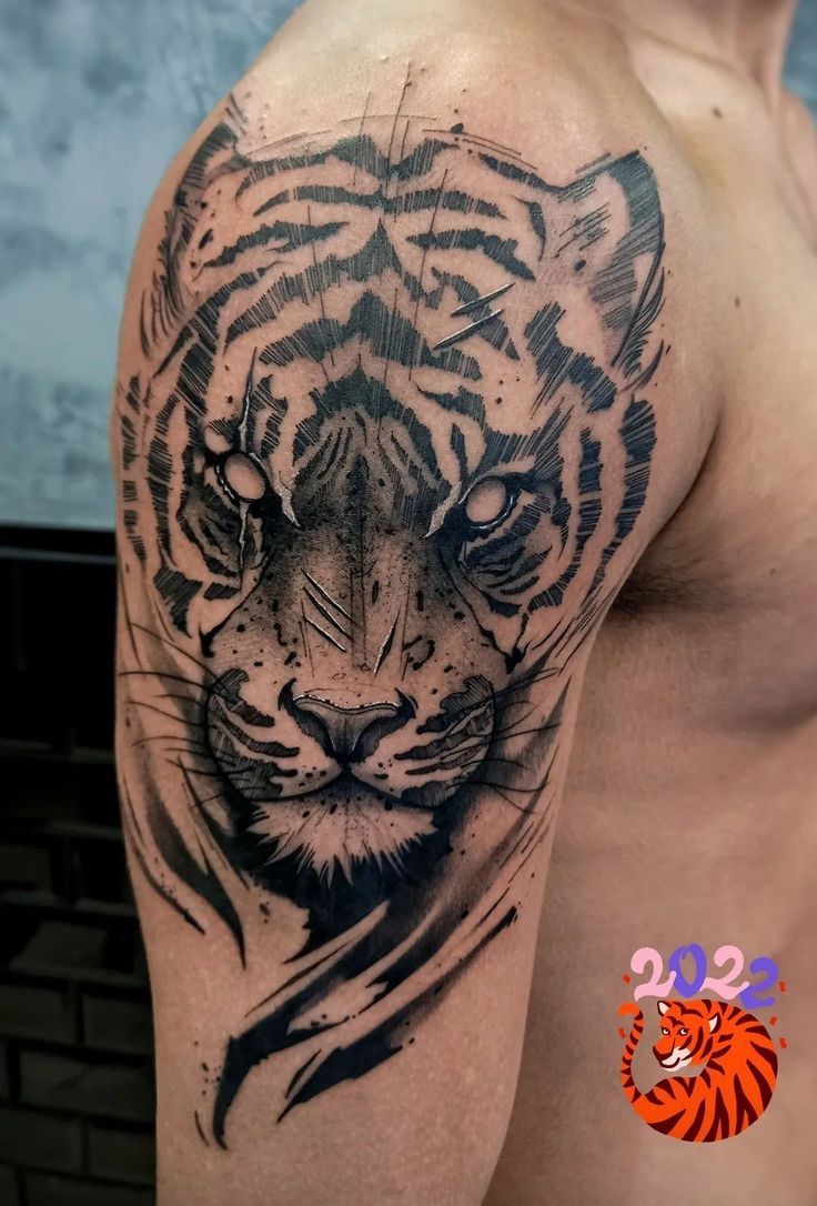 a man with a tiger tattoo on his arm