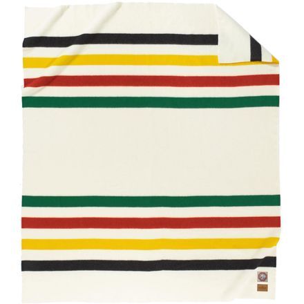 a white blanket with multicolored stripes on the front and back of it,