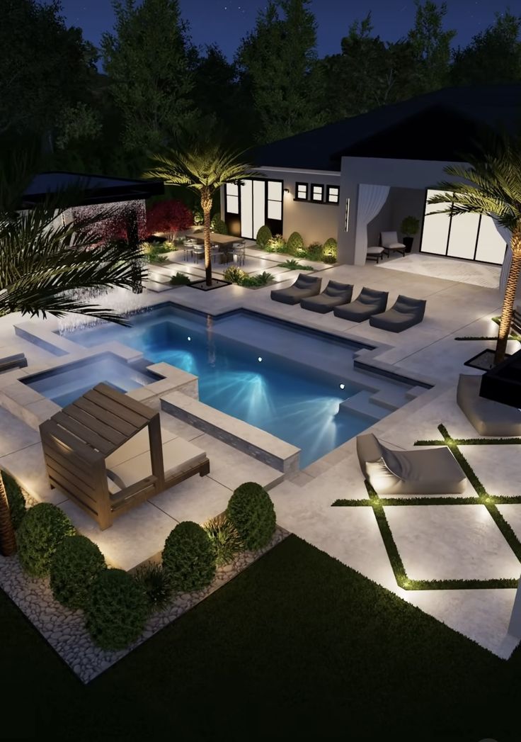 an aerial view of a pool at night with lounge chairs and palm trees in the foreground