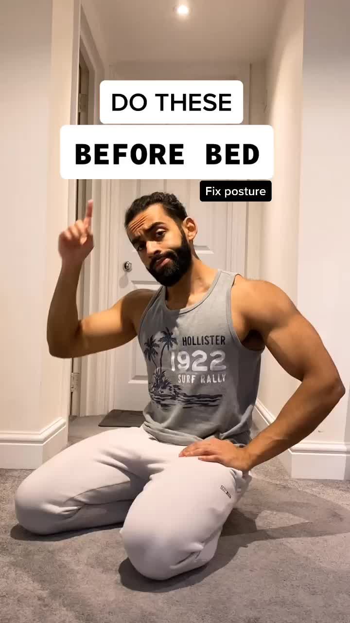 a man sitting on the floor in front of a sign that says do these before bed