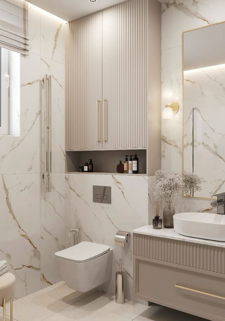 a white bathroom with marble walls and flooring