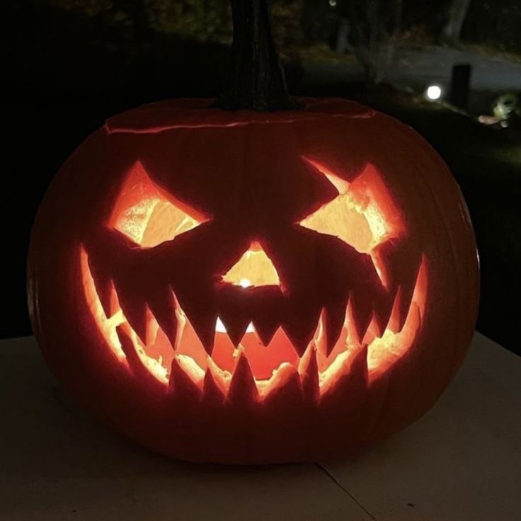 a carved pumpkin sitting on top of a table