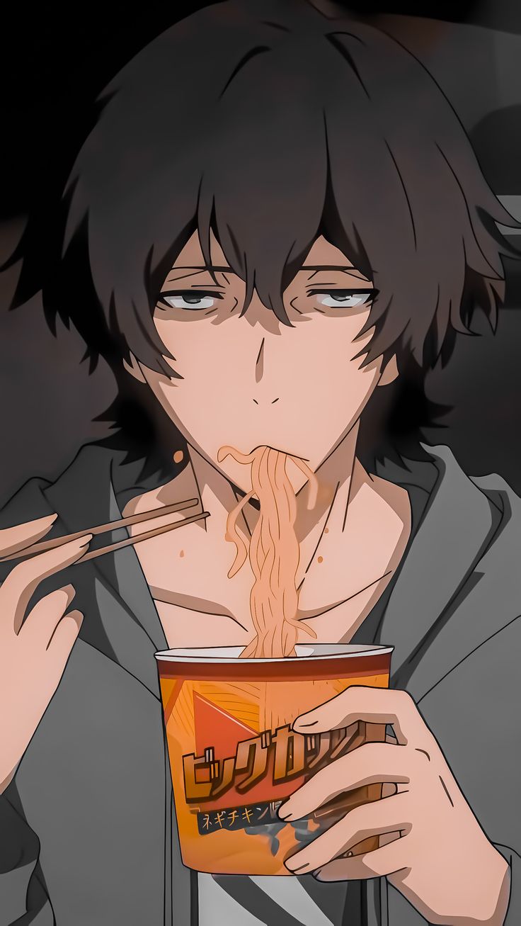 a man eating noodles from a bowl with chopsticks