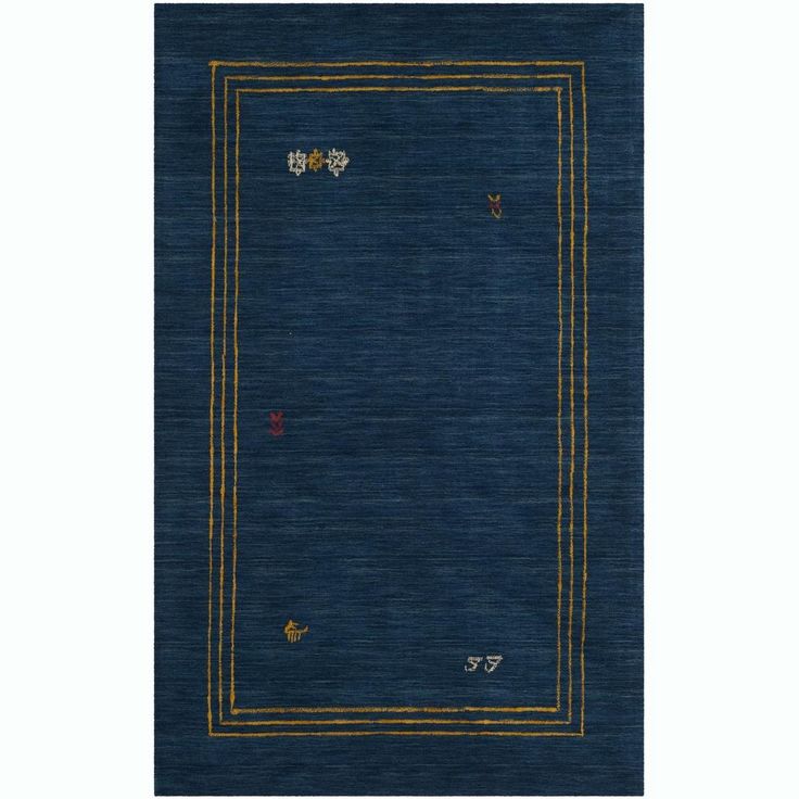 a blue rug with gold trimmings on it