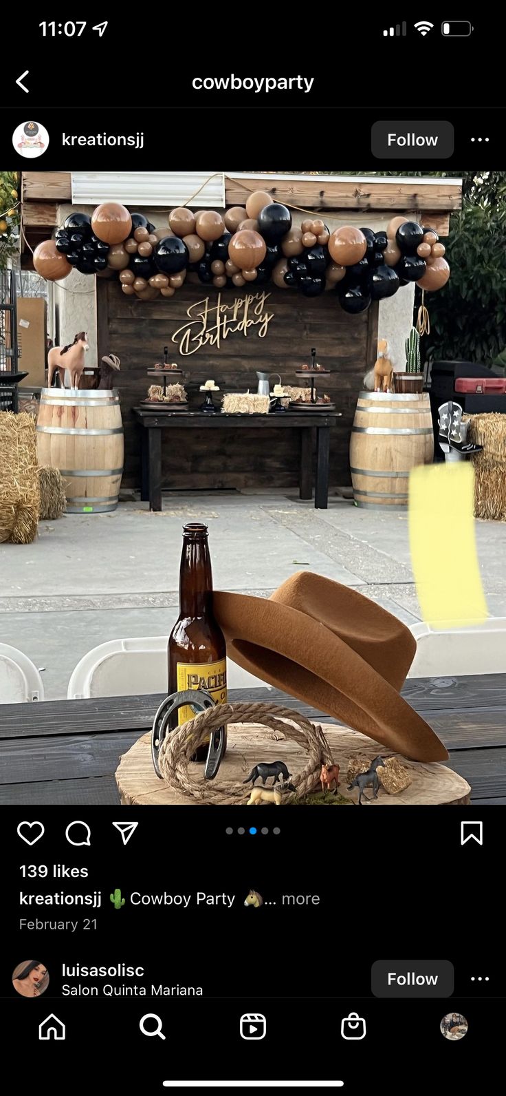 a bottle of beer sitting on top of a wooden table next to a cowgirl party sign