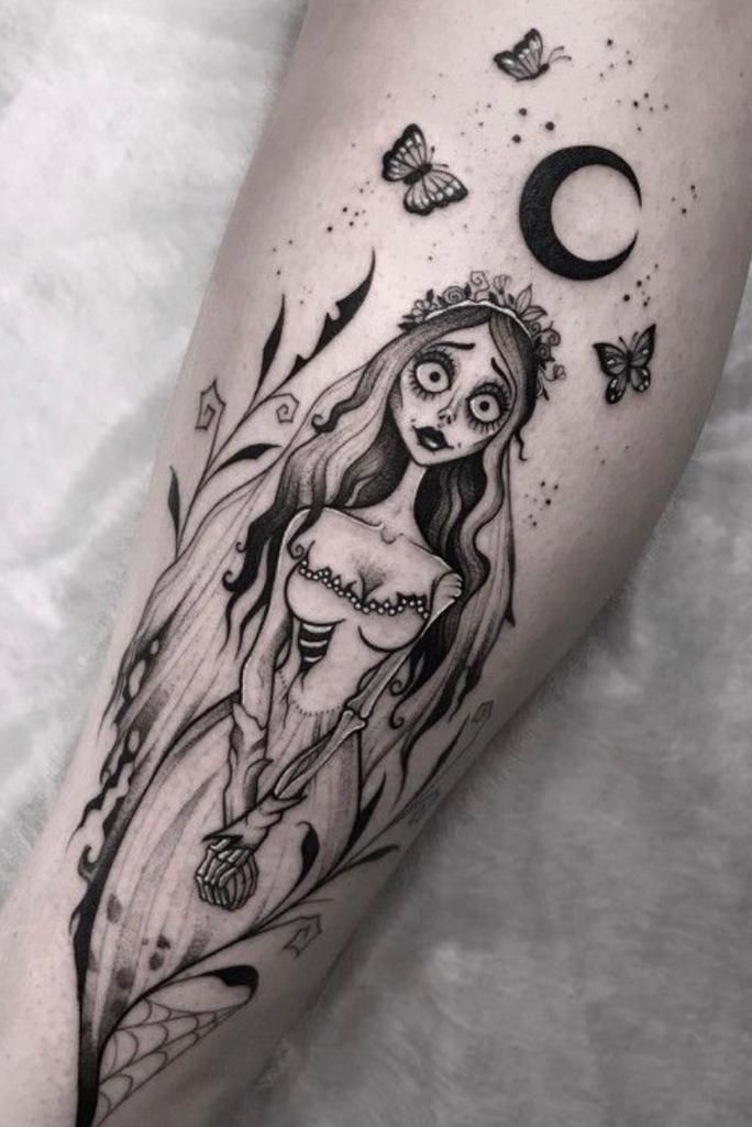 a woman's leg with a tattoo on it