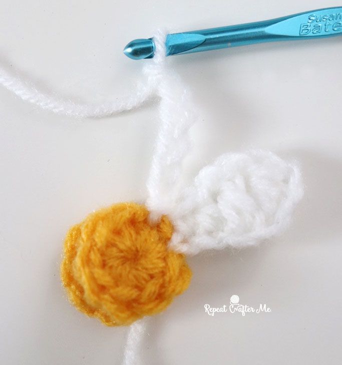 a crocheted piece of yarn with a ball of yarn attached to the end