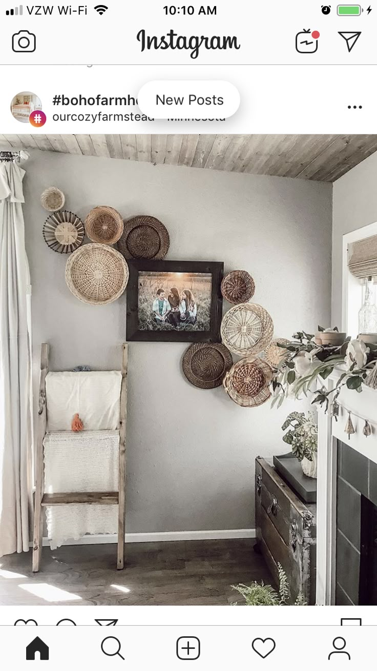 a living room with wicker baskets hanging on the wall