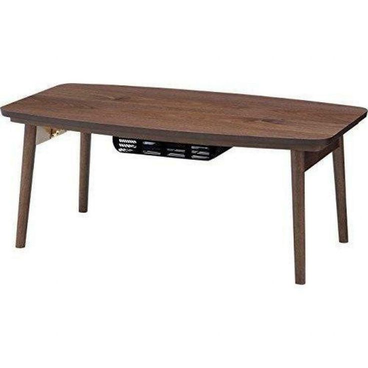 a wooden table with an electronic device underneath it on a white background in the image