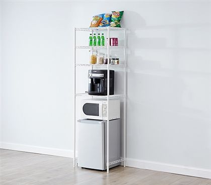 a microwave oven sitting on top of a white shelf