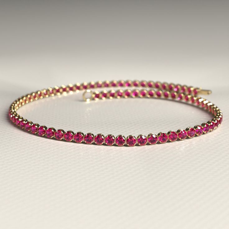 Enhance your style with this stunning Natural Ruby Tennis Bracelet. Handcrafted with care in 14K Gold, this custom stacking bracelet is perfect for July birthdays. Personalize your jewelry collection with this unique piece, or gift it to someone special during Christmas. 𝐅𝐞𝐚𝐭𝐮𝐫𝐞𝐬: * 𝐌𝐚𝐝𝐞 𝐭𝐨 𝐎𝐫𝐝𝐞𝐫 * 𝐌𝐞𝐭𝐚𝐥: 𝟏𝟒𝐊 * 𝐁𝐚𝐧𝐝 𝐂𝐨𝐥𝐨𝐫𝐬: Rose Gold, Yellow Gold & White Gold * 𝐂𝐮𝐬𝐭𝐨𝐦 𝐂𝐫𝐨𝐜𝐨𝐝𝐢𝐥𝐞 𝐋𝐨𝐜𝐤 𝐒𝐭𝐨𝐧𝐞: * 𝐒𝐭𝐨𝐧𝐞 - Natural Ruby * 𝐒𝐡𝐚𝐩𝐞 - Round Cut * 𝐒𝐢𝐳𝐞 - 1.70 MM * 𝐂𝐚𝐫𝐚𝐭 𝐖𝐞𝐢𝐠𝐡𝐭 - 1.82 Carats (Varies with Bracelet Size) * 𝐏𝐢𝐞𝐜𝐞𝐬 - 82 Pieces (Varies with Bracelet Size) * 𝐂𝐨𝐥𝐨𝐫 - Pinkish Red * 𝐂𝐥𝐚𝐫𝐢𝐭𝐲 - VVS-VS ★ 𝐍𝐚𝐭𝐮𝐫𝐚𝐥 𝐌𝐢𝐧𝐞𝐝 & 𝐄𝐭𝐡𝐢𝐜𝐚𝐥𝐥𝐲 𝐒𝐨𝐮𝐫𝐜𝐞𝐝 𝐆𝐞𝐦𝐬𝐭𝐨𝐧𝐞★ 𝐍𝐨𝐭𝐞𝐬: * Ruby Tennis Bracelet In Yellow Gold For Anniversary, Yellow Gold Ruby Tennis Bracelet For Anniversary, Anniversary Ruby Tennis Bracelet In Yellow Gold, Stacked Wedding Rings, Wrist Game, Birthstone Bracelet, Band Bracelet, Birthstone Bracelets, Engagement Rings Oval