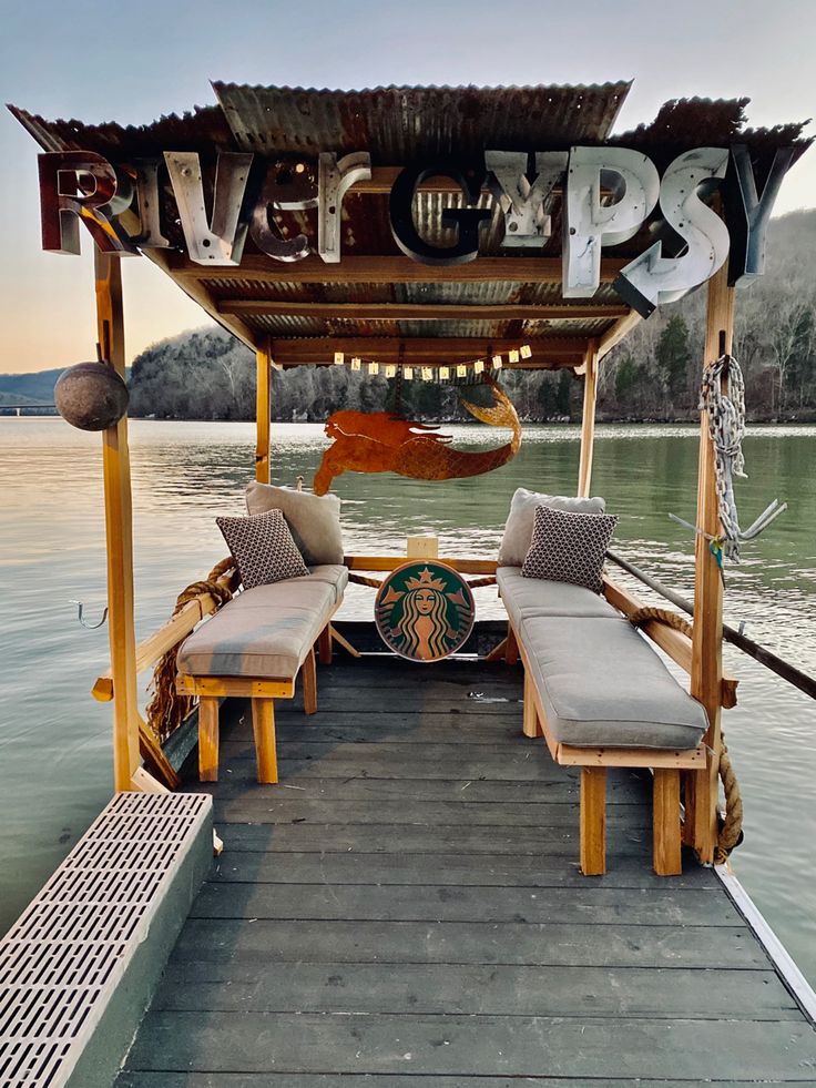 an outdoor seating area on the deck of a boat