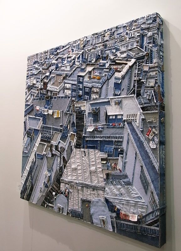 a large painting on the wall of a building with lots of windows and balconies