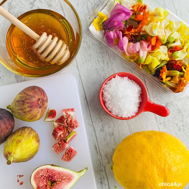 figs, honey, and other ingredients on a cutting board