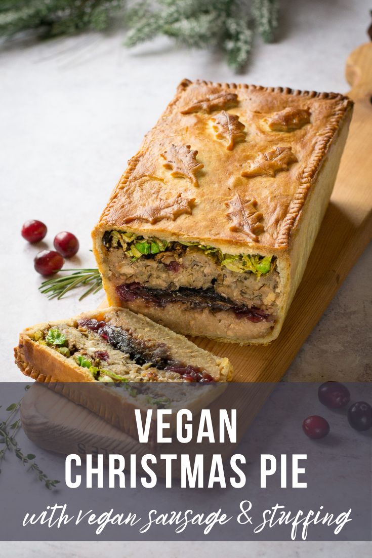 vegan christmas pie with veggie sausage and stuffing on a wooden cutting board