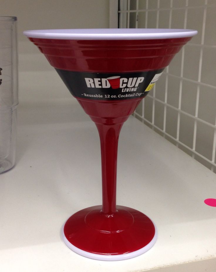 a red cup sitting on top of a counter