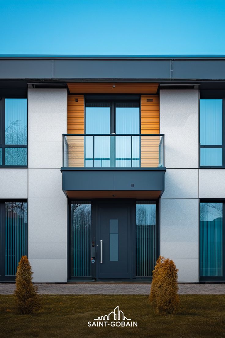 an apartment building with balconies on the second floor