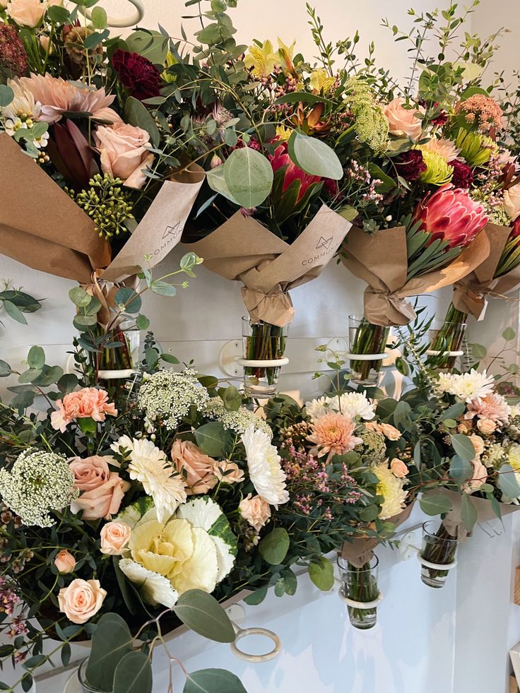 a bunch of flowers that are sitting on a table