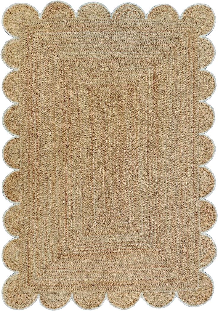 a beige rug with scalloped edges