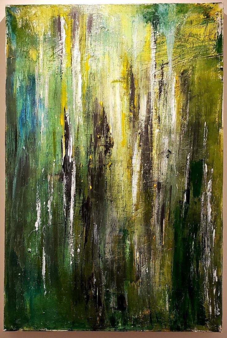 an abstract painting with green, yellow and white colors on the canvass is shown