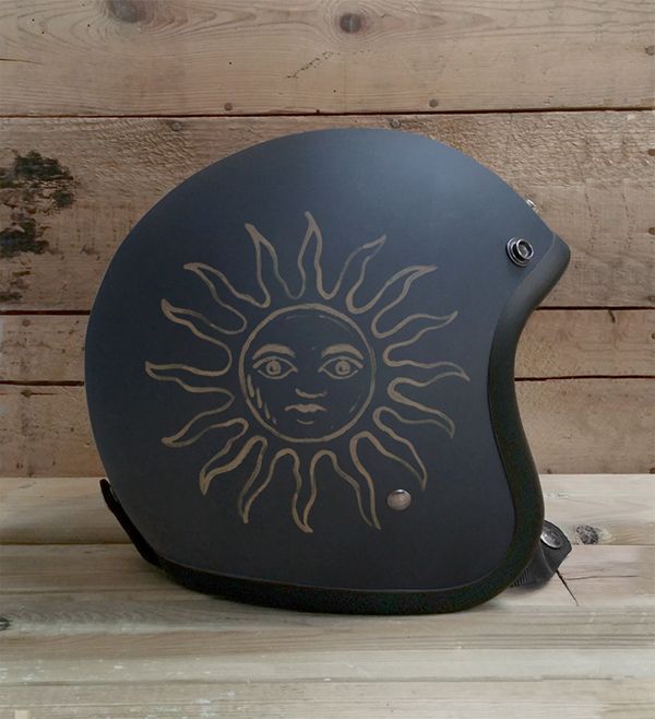 a helmet with the sun drawn on it