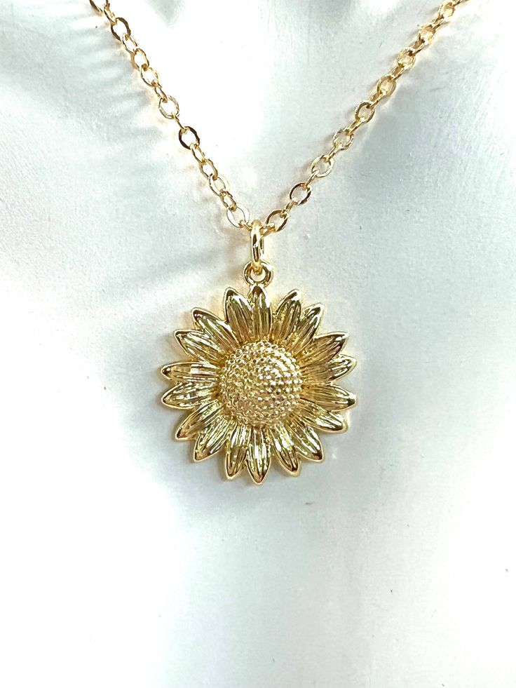 Beautiful Sunflower Necklace. Sunflower Pendant hangs from a heavier Goldfilled Flat Cable Chain. Spring Ring Closure Accented with Faceted Citrine Rondelles. Necklace measures 17 1/2 inches in length. Sunflower Pendant measures 23 mm in size. Minimalist Necklace. Gift Boxed with Ribbon Detail for Gift Giving. All Jewelry in Ella Cole Designs is fully guaranteed. Please contact me with any issues, concerns, or questions, and I will do everything I can to accommodate you. You and your business mean so much to me. Thank you so much for visiting Ella Cole Designs. Yellow Gold Flower Charm Necklace, Dainty Clavicle Chain Necklace With Flower Pendant, Delicate Chain Charm Necklace With Flower Pendant, Adjustable Gold Necklace With Flower Pendant, Adjustable Yellow Gold Flower Necklaces, Adjustable Yellow Gold Flower Necklace, Adjustable Flower-shaped Yellow Gold Necklace, Sunflower Design Floral Jewelry, Adjustable Delicate Chain Necklace With Flower Pendant