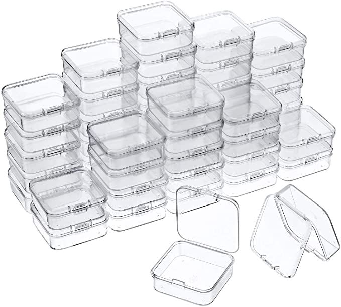 plastic food storage containers with lids and dividers are stacked on top of each other