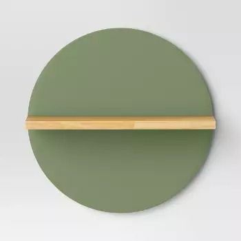 a green plate with a wooden shelf on it