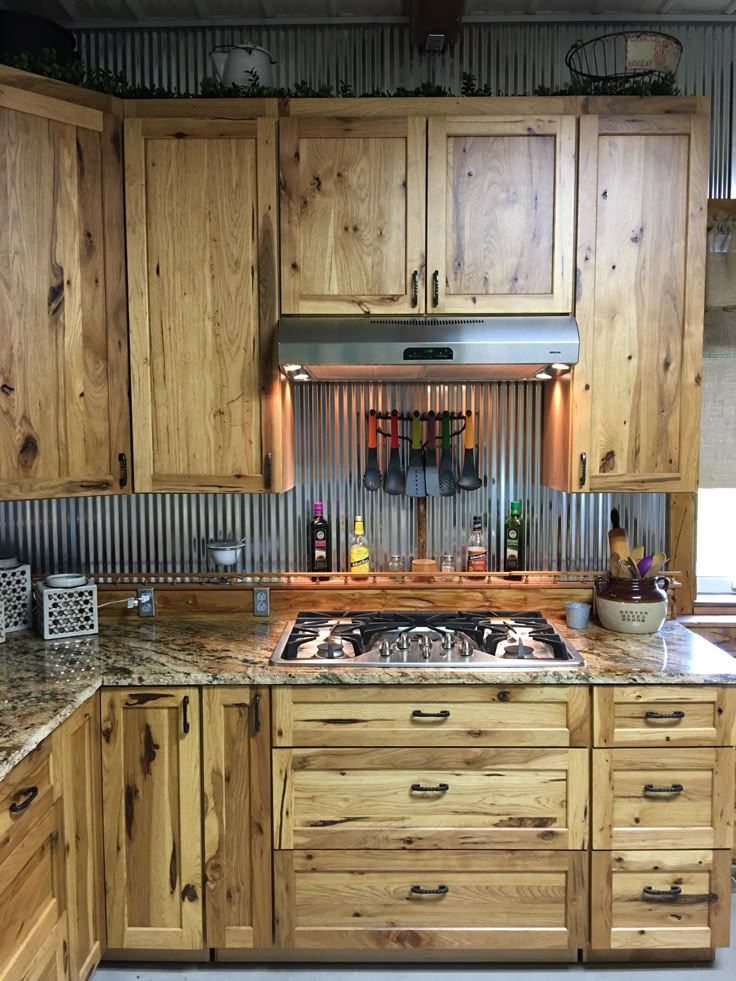 a kitchen with wooden cabinets and granite counter tops