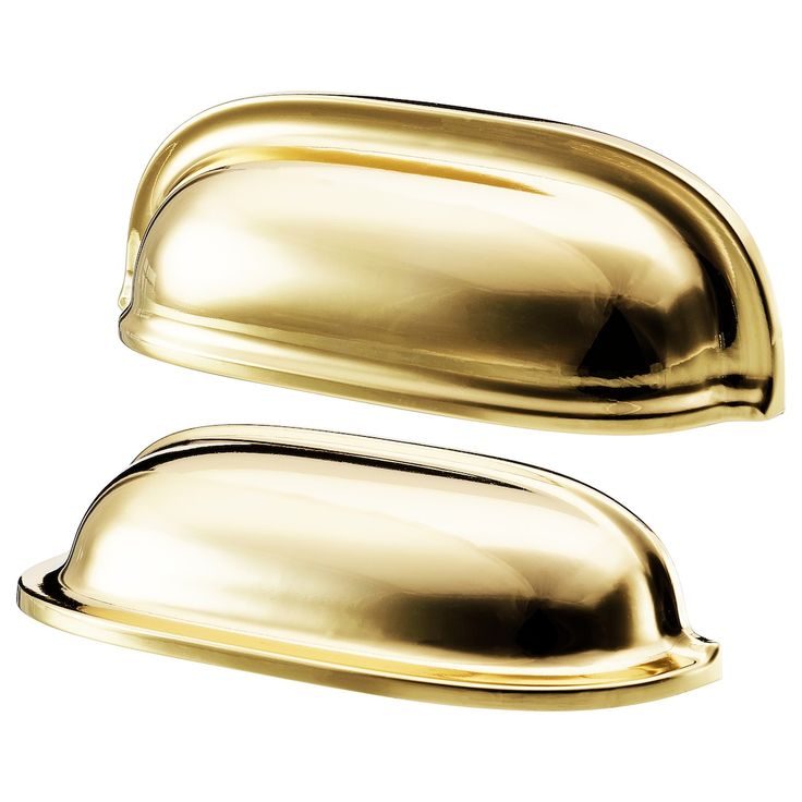 two shiny gold door handles on a white background