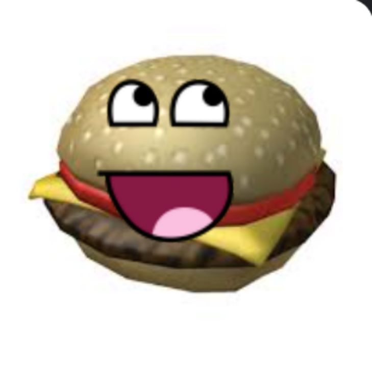 an animated hamburger with eyes and tongue sticking out from it's bun, smiling