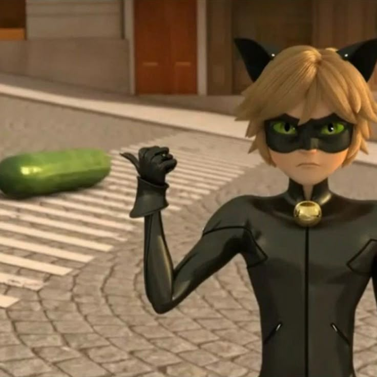 the animated character is dressed in black and has her hands up with two green eyes